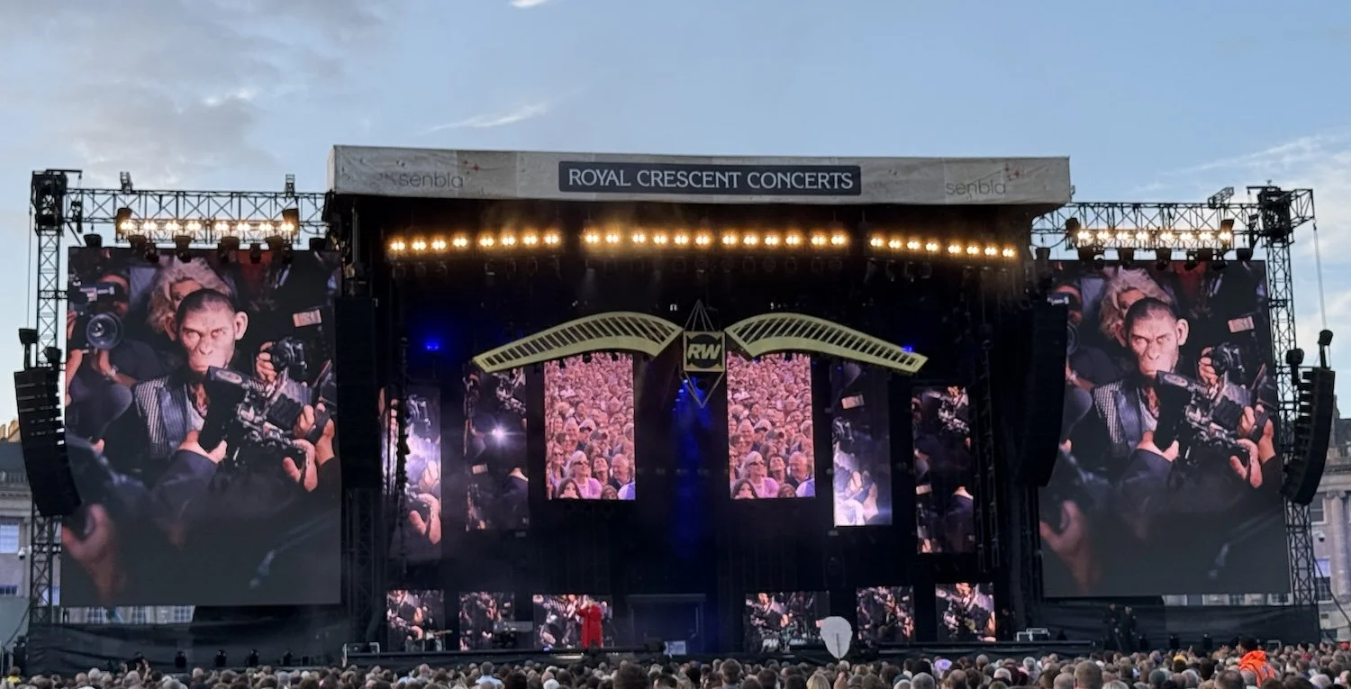 Stadium stage of Robbie Williams’ 2025 tour with large video screens
