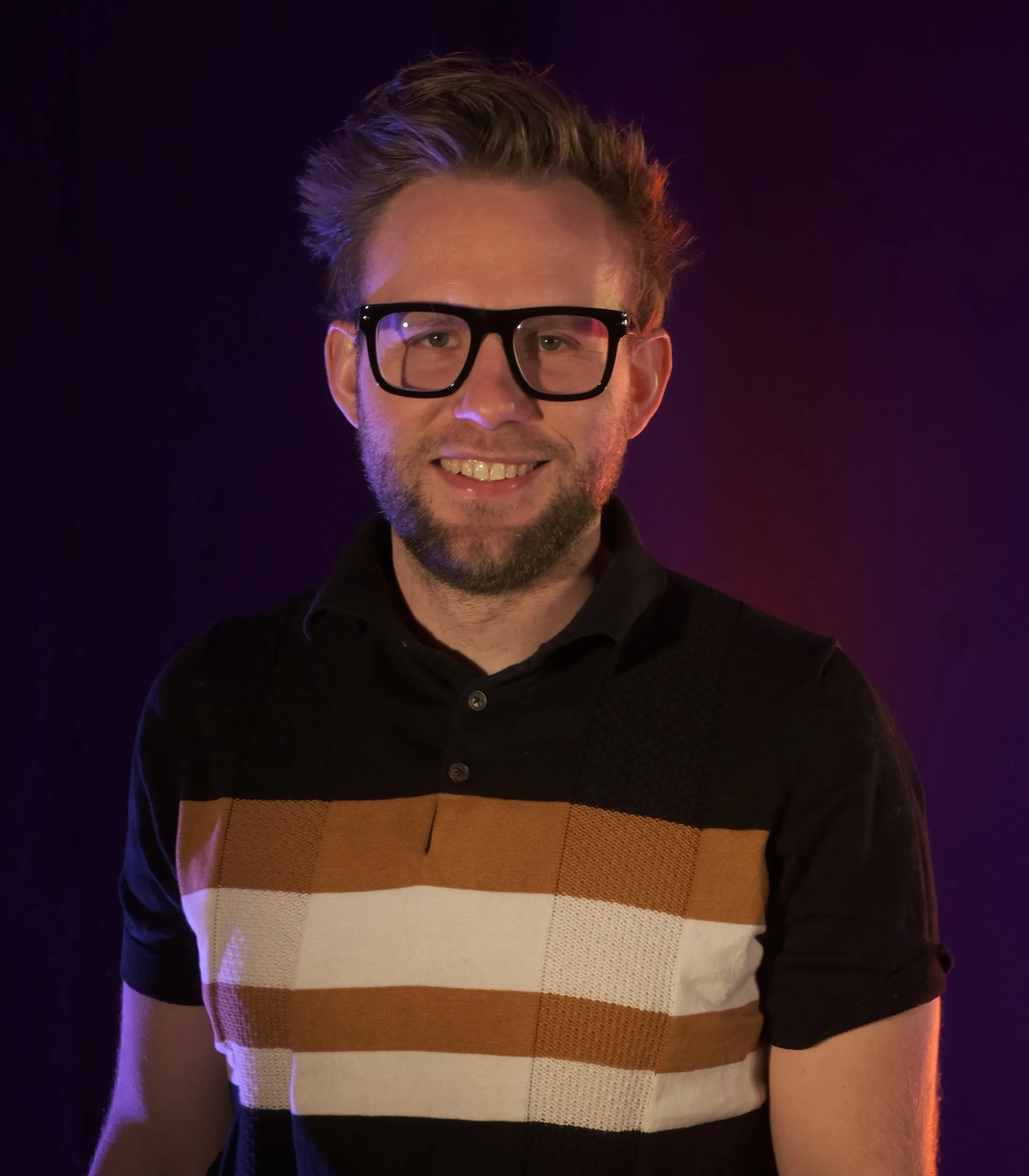 Giovanni Desramault, creative director of TECside, in purple studio light
