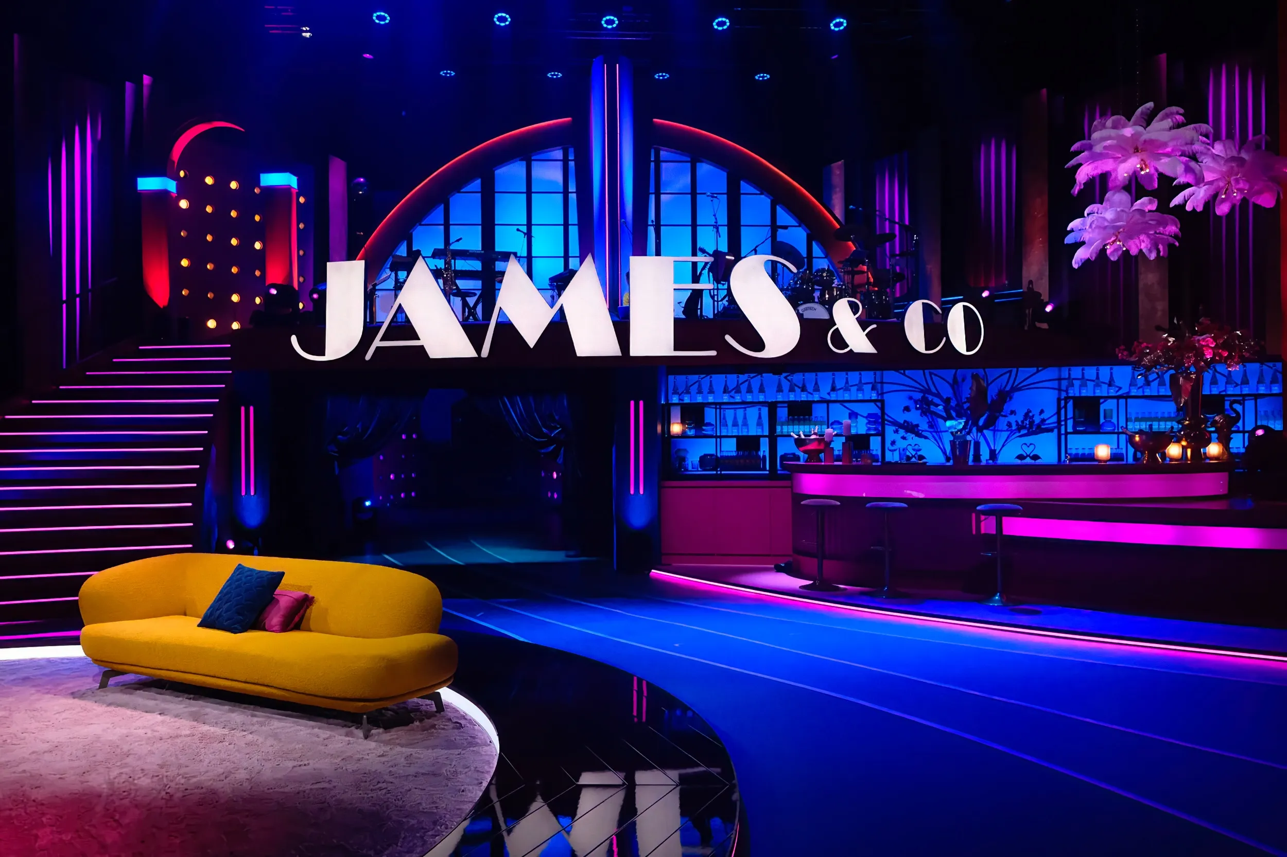 James & Co studio set with illuminated letters, LED staircase and purple accents