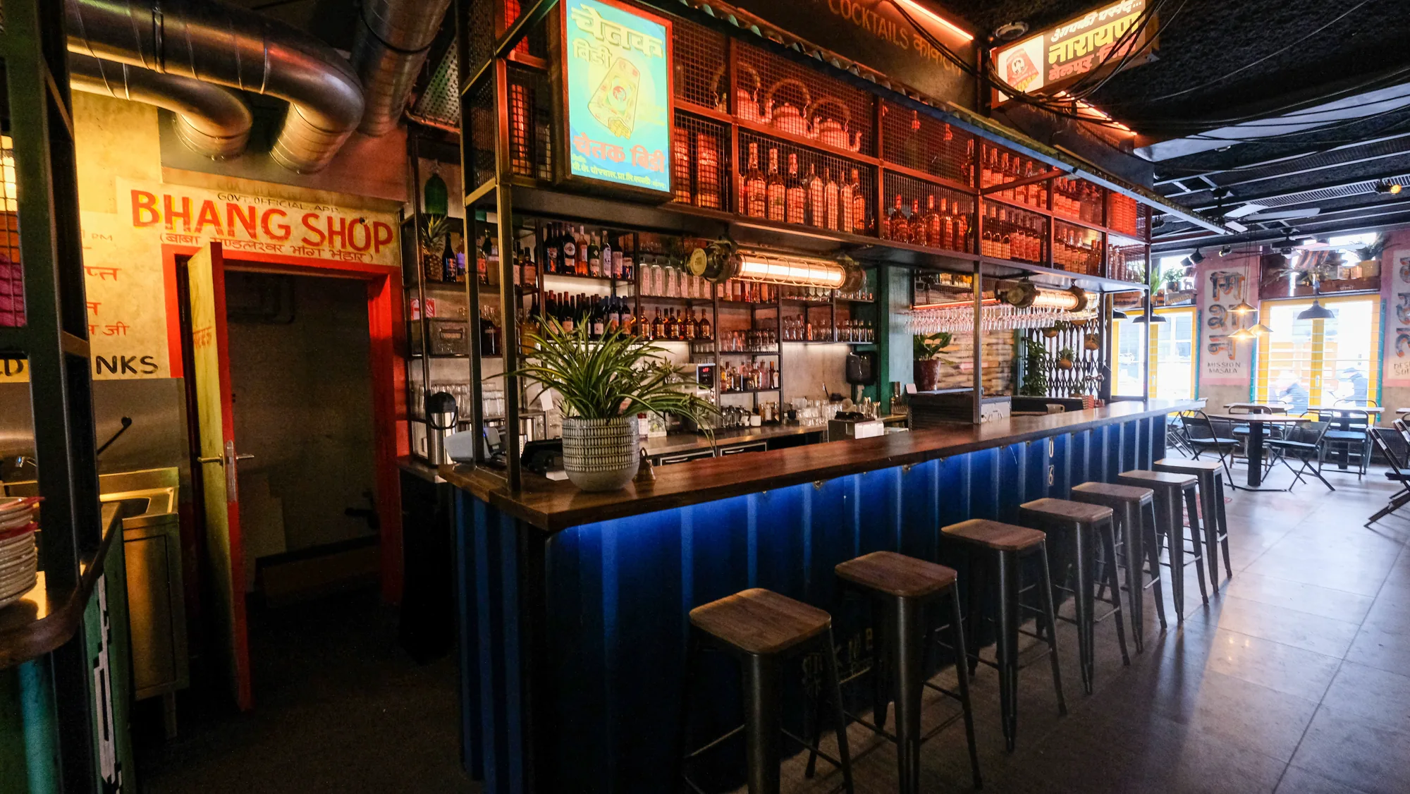 Mission Masala bar in Ghent with blue LED lighting and Bhang Shop sign