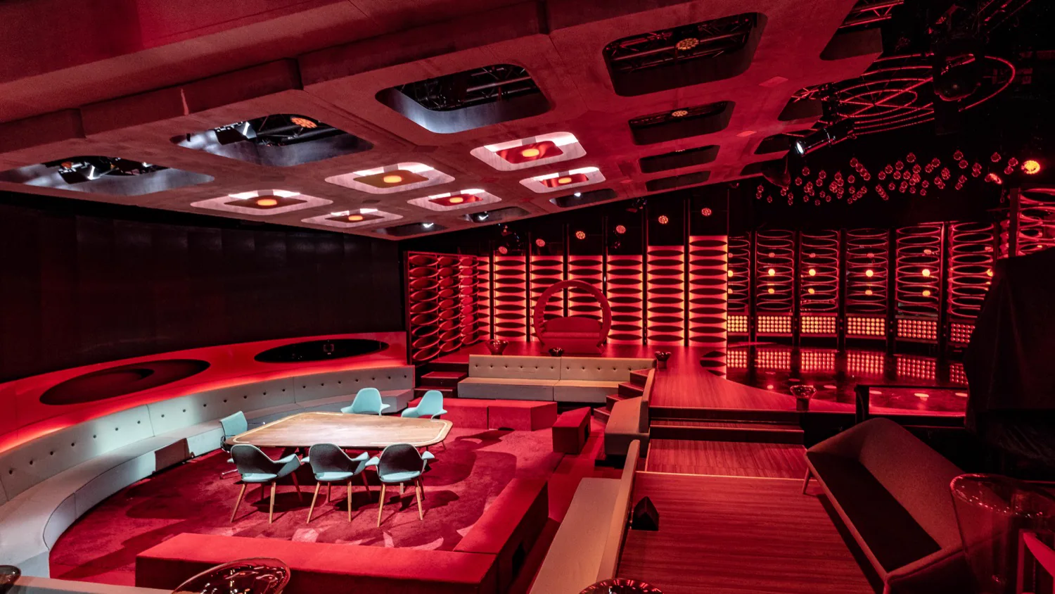 Red-lit Van Gils & gasten set with stage and digital LED strips