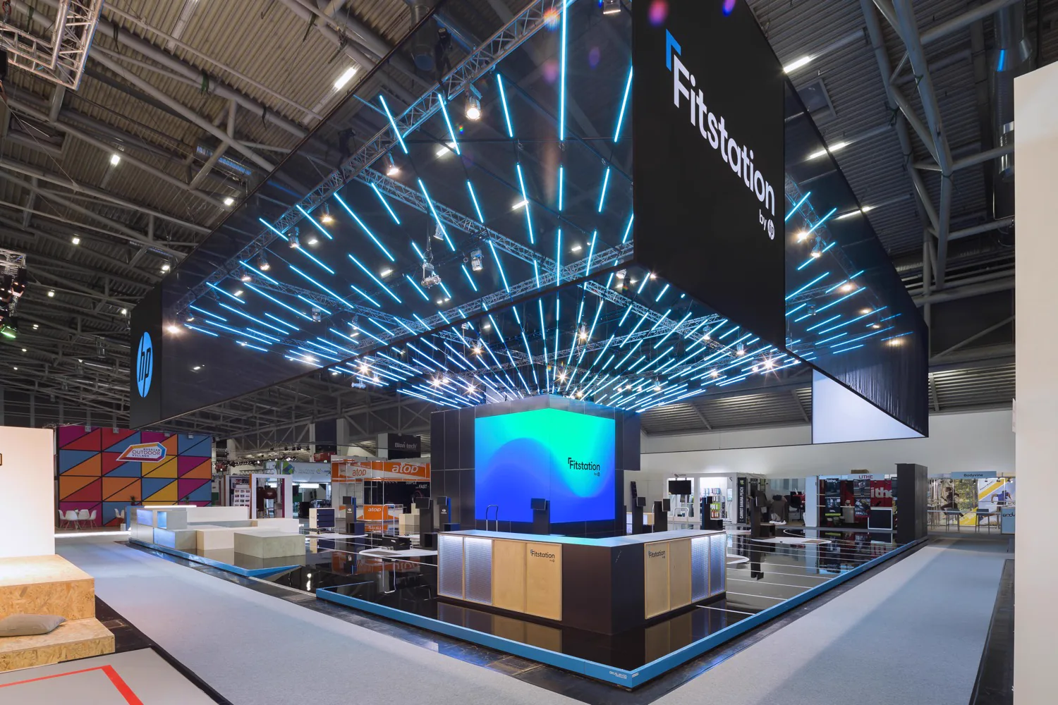 HP Fitstation stand at ISPO Munich with floating LED tubes