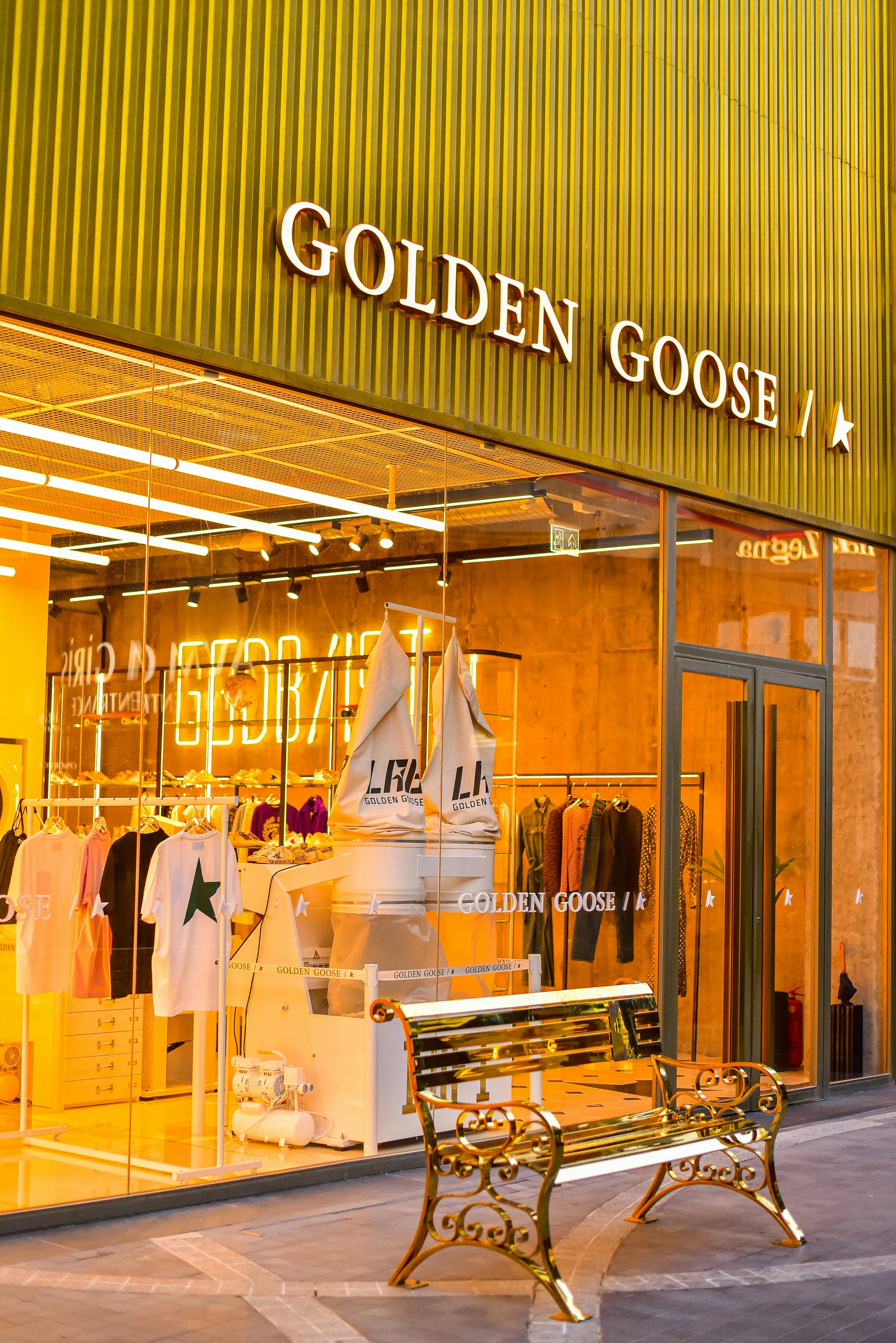 Golden Goose shop window highlighted with warm LED lighting